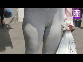 spying slender legs of a girl in gray leggings