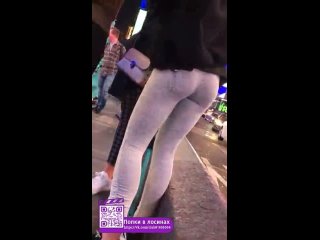 peeping ass of a young girl in gray leggings